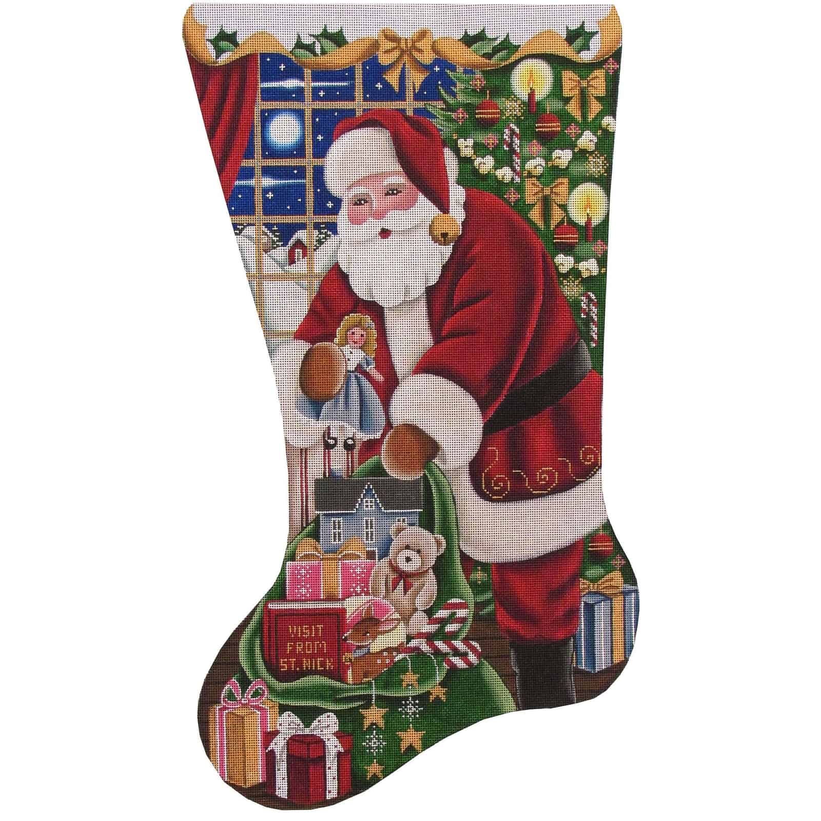 Needlepoint canvas in the shape of a Christmas stocking, featuring Santa Claus beside a decorated Christmas tree, wrapped gifts, toys, and a teddy bear, with a moonlit winter window scene and festive holiday greenery in the background.