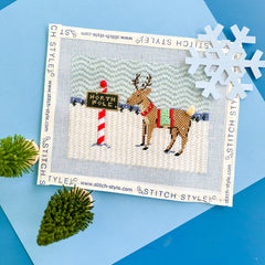Stitch Style Reindeer Games Series: Reindeer and North Pole Sign Needlepoint Canvas