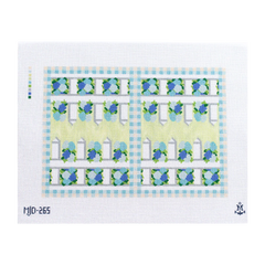 Needlepoint canvas for a backgammon board featuring a light green and blue geometric and floral border design with repeating gateālike motifs.