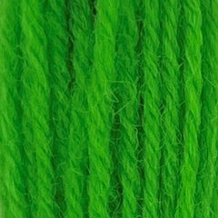 Close-up of bright neon‑green crewel wool thread with a soft, fuzzy texture and tightly twisted strands.