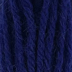 Close-up of hot neon blue tapestry wool thread with a soft, fuzzy texture and tightly twisted strands.