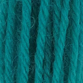 Close-up of hot neon‑teal crewel wool thread with a soft, fuzzy texture and tightly twisted strands.