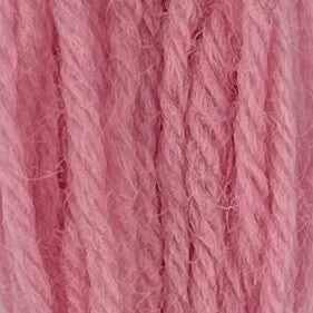 Close-up of very light bubble gum pink tapestry wool thread with a soft, fuzzy texture and tightly twisted strands.