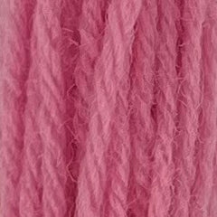 Close-up of light bubble gum pink tapestry wool thread with a soft, fuzzy texture and tightly twisted strands.