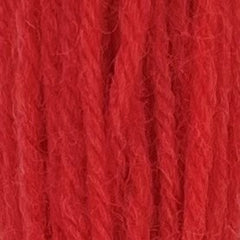 Close-up of sherbert red tapestry wool thread with a soft, fuzzy texture and tightly twisted strands.