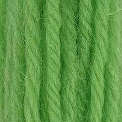 Close-up of sherbert mint tapestry wool thread with a soft, fuzzy texture and tightly twisted strands.
