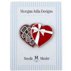 Heart‑shaped needle minder resembling an open box of chocolates on a Morgan Julia Designs card.