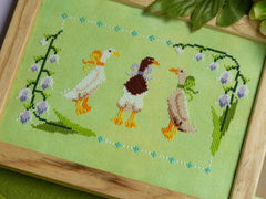 Sprouting Lupine Ducks in a Bow Cross Stitch Pattern