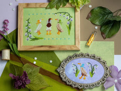 Sprouting Lupine Ducks in a Bow Cross Stitch Pattern