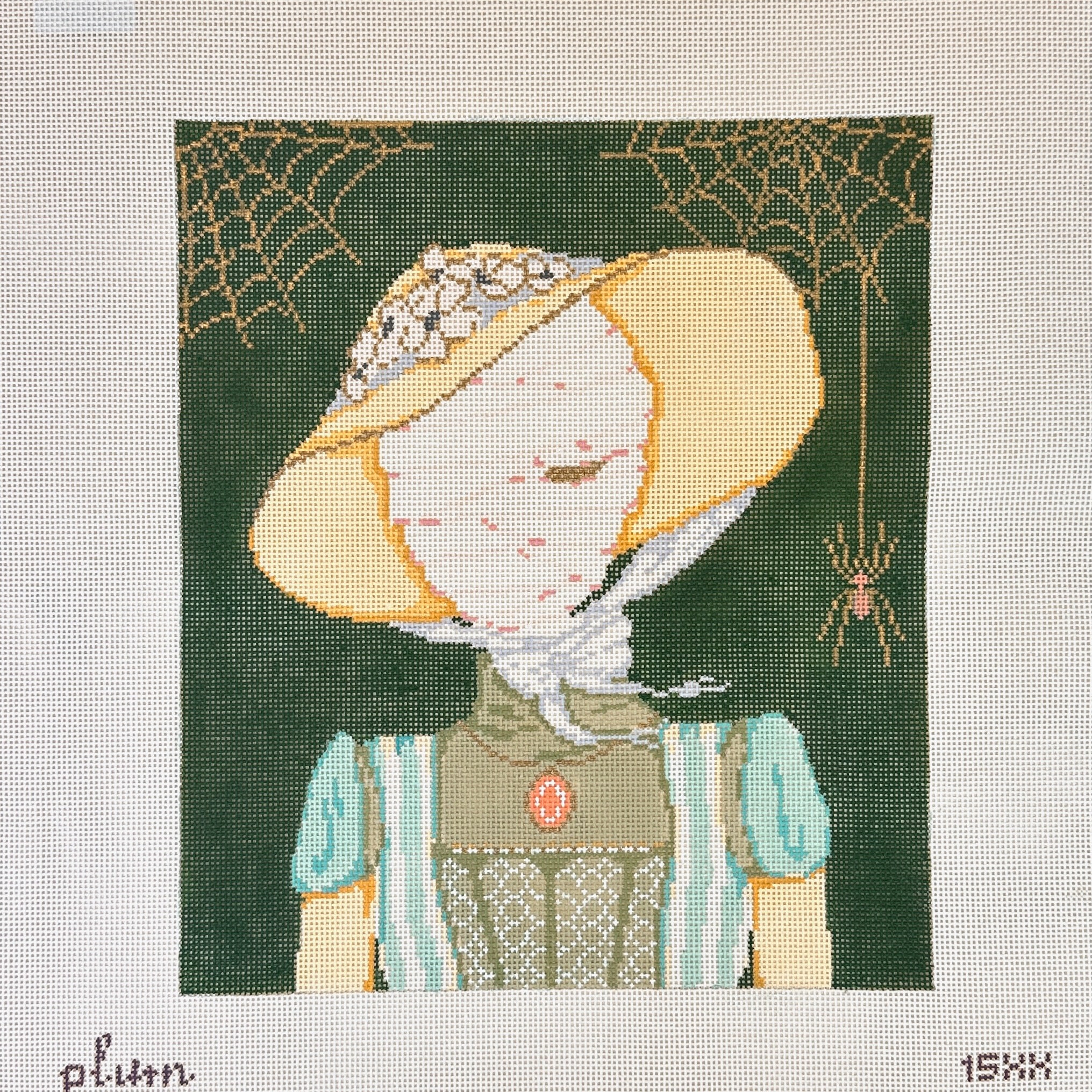 Needlepoint canvas featuring a vintage-style portrait of a mummy in a wide-brimmed yellow bonnet with floral trim, wearing a blue dress and lace bodice, framed by gold spiderweb motifs and spiders on a dark green background.