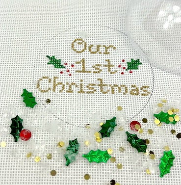 Kate Dickerson Needlepoint Collections Christmas Ornament with Clear Dome Cover and Confetti Our First Christmas with Holly Gold Letters Needlepoint Canvas
