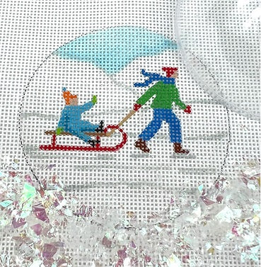 Kate Dickerson Needlepoint Collections Round with Clear Dome and Confetti Child Pulling Toddler on Sled In Snow Needlepoint Canvas