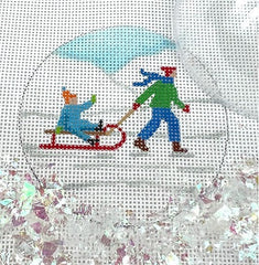Kate Dickerson Needlepoint Collections Round with Clear Dome and Confetti Child Pulling Toddler on Sled In Snow Needlepoint Canvas
