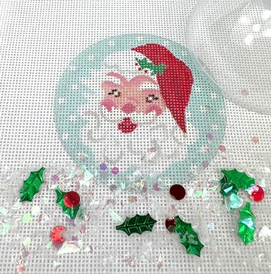 Kate Dickerson Needlepoint Collections Christmas Ornament with Clear Dome Cover and Confetti Jolly Santa Face on Snowy Sky Needlepoint Canvas