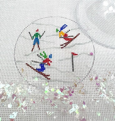 Kate Dickerson Needlepoint Collections Round with Clear Dome and Confetti Skiers on Sparkly White Slopes Needlepoint Canvas