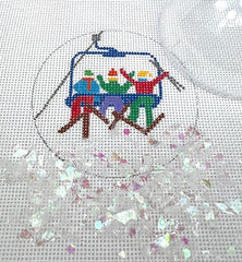 Kate Dickerson Needlepoint Collections Round with Clear Dome and Confetti Skiers on Chair Lift Needlepoint Canvas