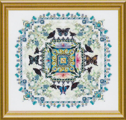 Cross stitch butterfly mandala in perfect symmetry around a bold central medallion.