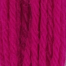 Close-up of bright neon‑pink crewel wool thread with a soft, fuzzy texture and tightly twisted strands.