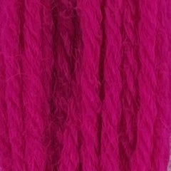 Close-up of bright neon‑pink crewel wool thread with a soft, fuzzy texture and tightly twisted strands.