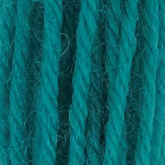 Close-up of bright hot neon-teal crewel wool thread with a soft, fuzzy texture and tightly twisted strands.