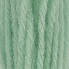 Close-up of sherbert blue crewel wool thread with a soft, fuzzy texture and tightly twisted strands.