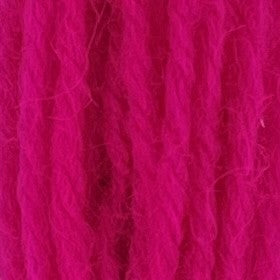 Close-up of cool neon pink tapestry wool thread with a soft, fuzzy texture and tightly twisted strands.