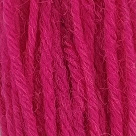 Close-up of very dark bubble gum pink tapestry wool thread with a soft, fuzzy texture and tightly twisted strands.