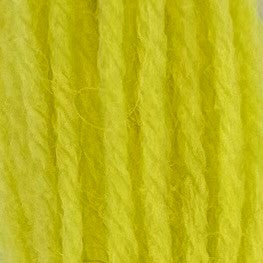 Close-up of sherbert yellow tapestry wool thread with a soft, fuzzy texture and tightly twisted strands.