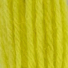 Close-up of sherbert yellow tapestry wool thread with a soft, fuzzy texture and tightly twisted strands.