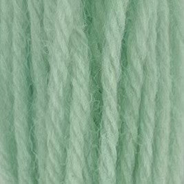 Close-up of sherbert blue crewel wool thread with a soft, fuzzy texture and tightly twisted strands.