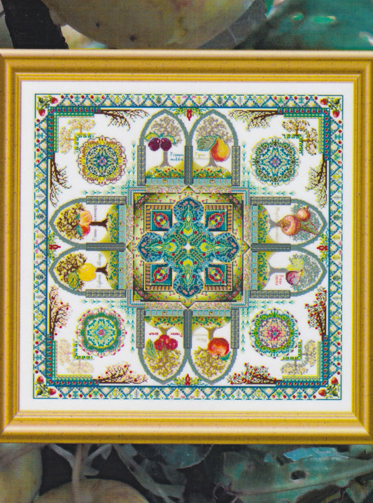 Framed cross stitch of a colorful medieval fruit garden mandala with trees, fruit, birds, and arches arranged around a patterned central medallion.