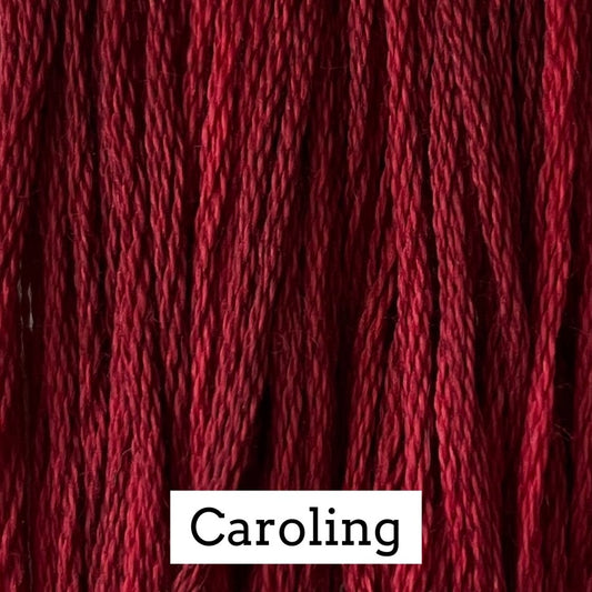 Close-up of deep burgundy cotton embroidery floss with subtle tonal variation, labeled “Caroling.”