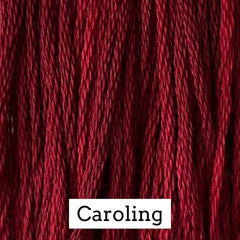 Close-up of deep burgundy cotton embroidery floss with subtle tonal variation, labeled “Caroling.”