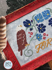 Close up of the bald eagle on the same cross stitch.