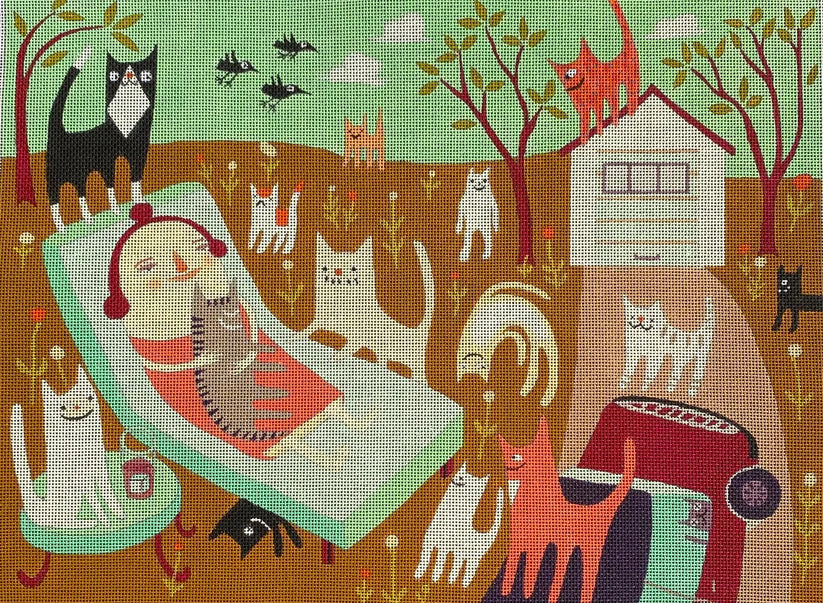 Needlepoint canvas depicting a whimsical outdoor scene with a lounging cat‑loving woman surrounded by many stylized cats, birds, trees, and a small house in warm earthy tones and soft pastels.