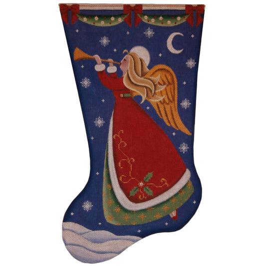 Needlepoint canvas in the shape of a Christmas stocking, featuring an angel in a red robe playing a trumpet beneath a crescent moon and stars, with gold wings, holiday garlands, and a snowy winter landscape against a deep blue night sky.