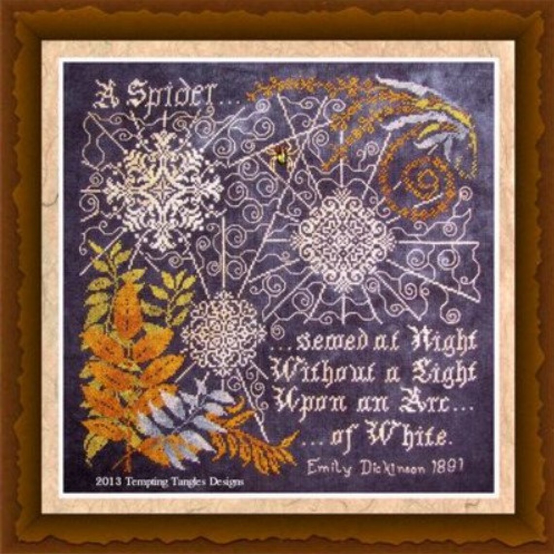 Framed cross stitch of three very large and lovely Quaker motifs, spider webs or snowflakes.