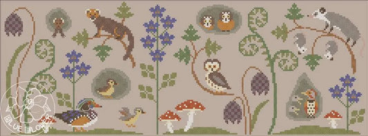 A flat cross stitch scene featuring woodland animals, birds, and mushrooms arranged among ferns and blue flowers in a horizontal layout.