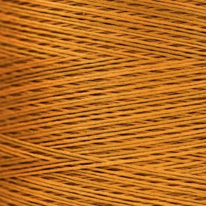 Close-up of golden‑yellow overdyed embroidery floss wound tightly, showing warm tonal variation across the strands.