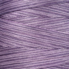 Close-up of lavender‑purple overdyed embroidery floss wound tightly, showing subtle shade variations in the strands.